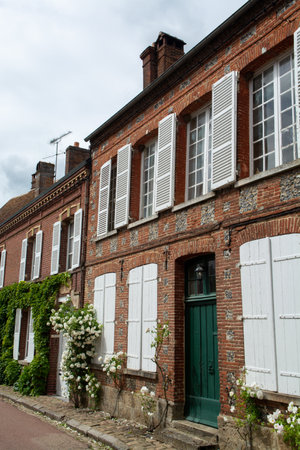Tourist destination, one of most beautiful french villages, Gerberoy - small historical village with half-timbered houses and colorful roses flowers, Franceのeditorial素材