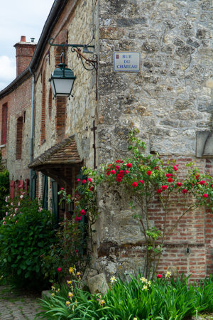 Tourist destination, one of most beautiful french villages, Gerberoy - small historical village with half-timbered houses and colorful roses flowers, Franceのeditorial素材