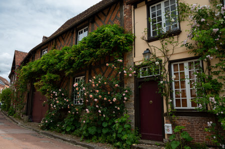 Tourist destination, one of most beautiful french villages, Gerberoy - small historical village with half-timbered houses and colorful roses flowers, Franceのeditorial素材