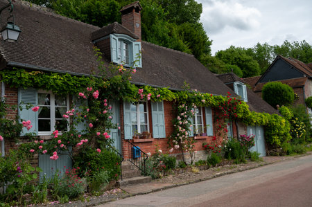 Tourist destination, one of most beautiful french villages, Gerberoy - small historical village with half-timbered houses and colorful roses flowers, Franceのeditorial素材