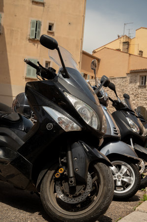 Street parking of motors in Saint Tropez, village on Mediterranean sea with yacht harbour, Provence, summer vacation in Franceのeditorial素材