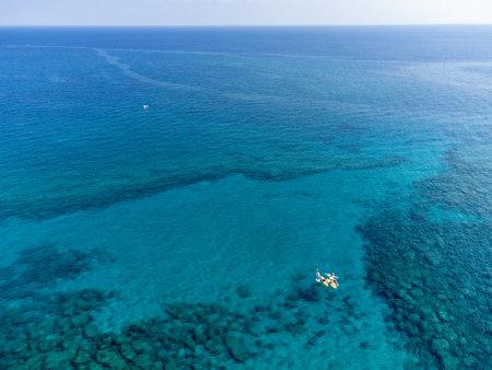 Aerial panoramic view on villas and holidays resorts and blue crystal clear water on Mediterranean...