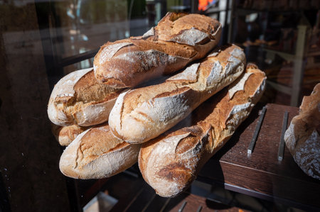 French bakery in Lyon, many fresh baked baguettes breads ready for sale close upの写真素材