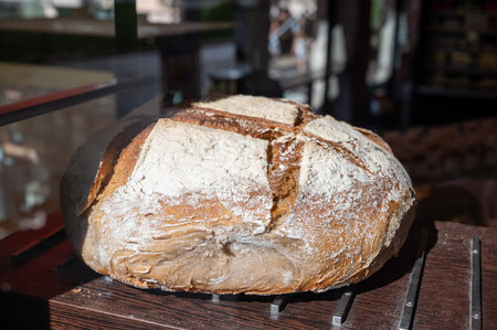 French bakery, fresh baked wheat bread ready for sale close up