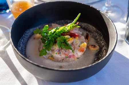 French sea food, tartare of seabass with mango, passion fruit and coconut milkの写真素材
