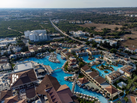 Aerial panoramic view on holidays villas and resorts and blue crystal clear water on Mediterranean sea near Nissi beach, Ayia Napa, Cyprus. Sea holidays.のeditorial素材