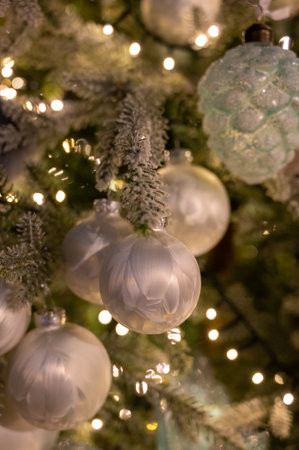 Christmas tree decorated is festivily decorated with vintage colorful balls, garlands and toys close up, Christmas background, winter holidaysの写真素材