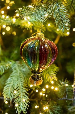 Christmas tree decorated is festivily decorated with vintage colorful balls, garlands and toys close up, Christmas background, winter holidaysの写真素材