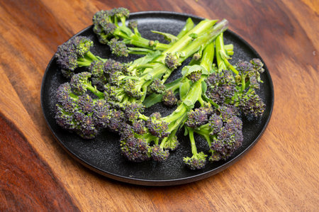 Dark green stems of fresh uncooked bimi asparagus broccoli vegetablesの写真素材