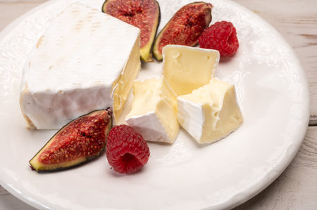 Cheese collection, French brie de Meaux cheese from Seine-et-Marne region with white mold close upの写真素材