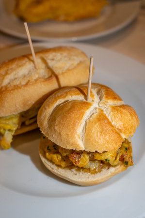 Typical mini burger snack of Basque Country, pinchos or pinxtos, small piece of bread with different toppings, served in bar in San-Sebastian or Bilbao, Spainの写真素材