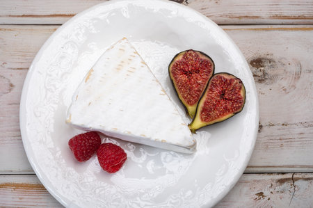 Cheese collection, French brie de Meaux cheese from Seine-et-Marne region with white mold close upの写真素材