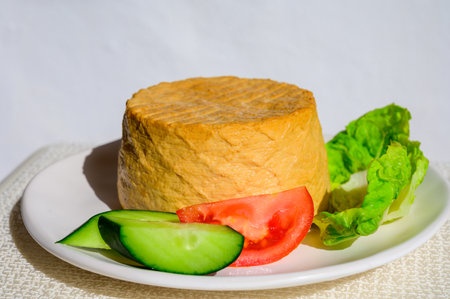 Cheese collection, piece of fresh smoked Spanish goat cheese close upの写真素材