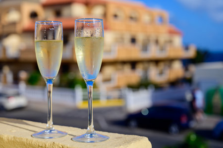 Dinner party, drinking of cava or champagne sparkling wine in vacation resort Caleta Fuste, Fuerteventura, Canary islands winter sun vacation, Spainの写真素材