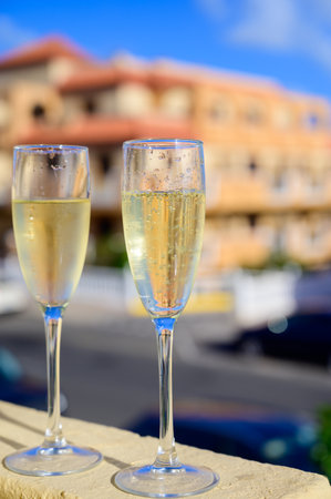 Dinner party, drinking of cava or champagne sparkling wine in vacation resort Caleta Fuste, Fuerteventura, Canary islands winter sun vacation, Spainの写真素材
