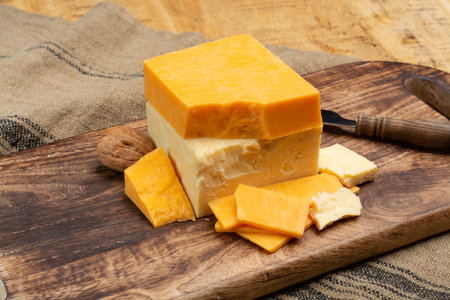 British cheeses collection, Scottish colored and English matured cheddar cheeses close upの写真素材