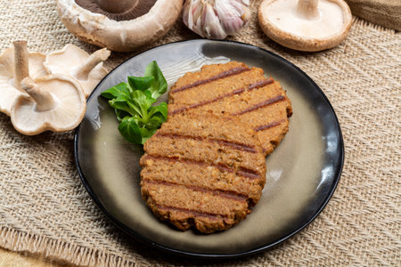 Tasty vegetarian burgers made from healthy quinoa, basil, portobello mushroom and shiitake mushrooms close upの写真素材
