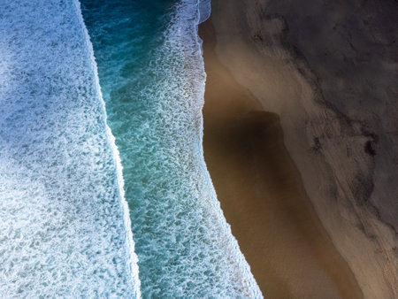 Aerial view on difficult to access golden sandy long Cofete beach hidden behind mountain range on Fuerteventura, Canary islands, Spainの写真素材