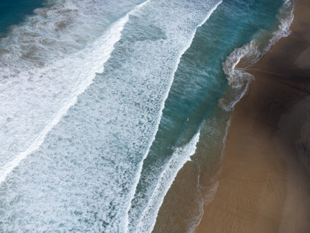 Aerial view on difficult to access golden sandy long Cofete beach hidden behind mountain range on Fuerteventura, Canary islands, Spainの写真素材