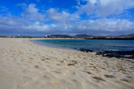 White sand, blue water and stormy clouds on La Concha beach, El Cotillo surfer's village, Fuerteventura, Canary islands, Spainの写真素材