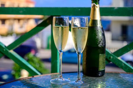 Dinner party, drinking of cava or champagne sparkling wine in vacation resort Caleta Fuste, Fuerteventura, Canary islands winter sun vacation, Spainの写真素材
