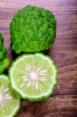 Citrus hystrix, green kaffir lime or makrut lime, citrus fruit native to tropical Southeast Asia. Fruit and leaves used in Southeast Asian cuisine, essential oil is used in perfumery for intense citrus fragrance.の写真素材