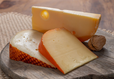 Cheese collection, tasty Belgian abbey cheeses made with brown beer close upの写真素材