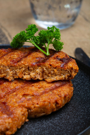 Tasty grilled vegan burgers made from vegetarian plant based soya beans imitation meat healthy lifestyleの写真素材