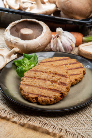 Tasty vegetarian burgers made from healthy quinoa, basil, portobello mushroom and shiitake mushrooms close upの写真素材