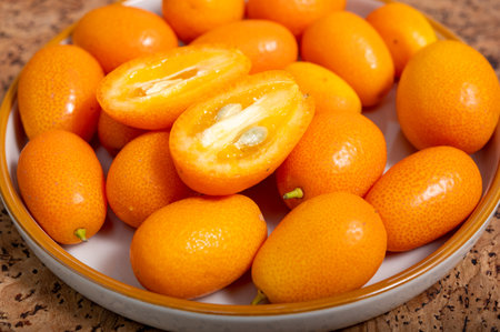 Delicious small citrus fruits orange kumquats close up.の写真素材