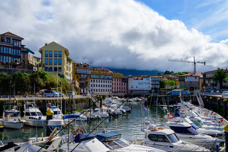 Vacation on Green coast of Asturias, views of Llanes touristic city with old harbour, North of...