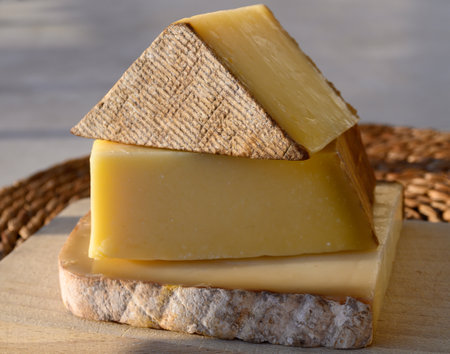 Cheese collection, French cow cheese comte, beaufort, abondance close up