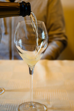 Tasting of cold grand cru sparkling white wine with bubbles champagne in old champagne house in grand cru wine producer small village Ambonnay, Champagne, Franceの写真素材