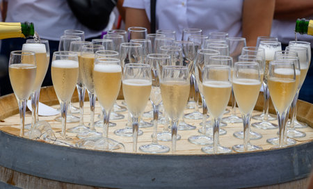 Tasting of sparkling white wine with bubbles champagne on summer weekend festival route of champagne...