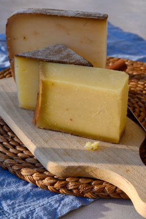 Cheese collection, French cow cheese comte, beaufort, abondance close upの写真素材