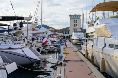Big white yachts and colorful houses in Port Grimaud, village on Mediterranean sea with yacht harbour, Provence, summer vacation in France.のeditorial素材