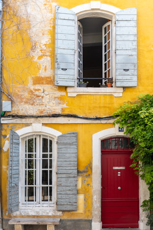 View on old narrow streets and houses in ancient french town Arles in Provence, touristic destination with Roman ruines, Bouches-du-Rhone, Franceのeditorial素材