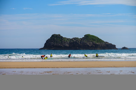 Young surfers train with boards on Playa de Palombina Las Camaras in Celorio, Green coast of...