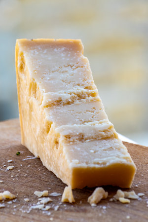 Traditional italian food - 36 months aged in caves Italian parmesan hard cow milk cheese from Parma,...