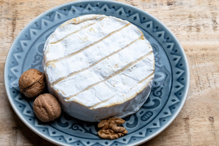 French soft Camembert cheese, original Camembert de Normandie, close up with white moldの写真素材
