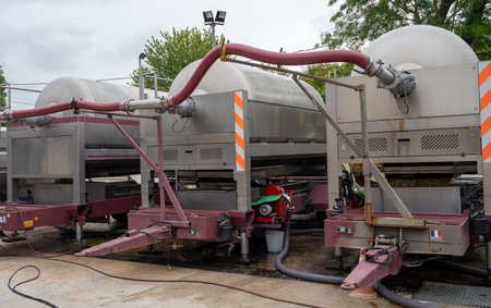 Works at distillery. Harvest time in Cognac white wine region, Charente, crushing and pressing of...