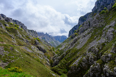 Driving narrow mountain road from Los Arenas to remote mountain village Sotres, Picos de Europa mountains, Asturias, North of Spain, view on gorge and mountainsの写真素材