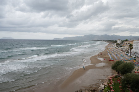 Sandy beach of medieval small touristic coastal town Sperlonga and sea shore, Latina, Italy on sunrise in summer holidaysの写真素材