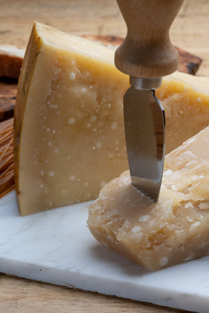Cheese collection, hard matured yellow Italian cheese parmesan or parmigiano reggiano close upの写真素材