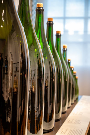 Different sizes of champagne bottles, traditional making champagne sparkling wine from chardonnay and pinor noir grapes, Epernay, Champagne, Franceの写真素材