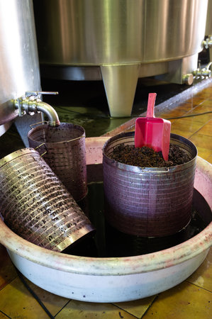 Harvesting works, fermentation of red pressed grapes juice in steel vats, Cabernet Sauvignon grape variety from Haut-Medoc vineyards in Bordeaux, left bank of Gironde Estuary, Franceの写真素材