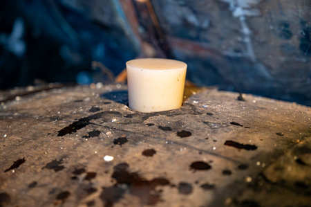 Aging process of cognac spirit in old dark French oak barrels in cellar in distillery house, Cognac white wine region, Charente, Segonzac, Grand Champagne, Franceの写真素材