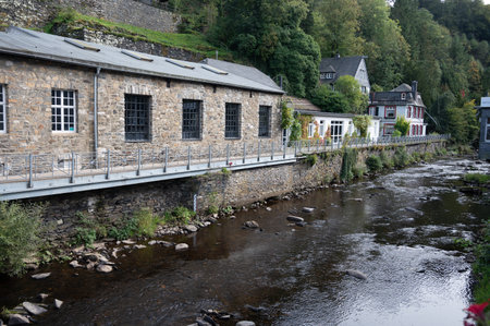 View of houses and streets of old colorful German town Monschau in bend of the river and hidden between the hills, Eifel national park, Germany in summerの写真素材