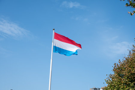 Views of flag of Luxembourg country in Luxembourg or Luxembourg City capital city and one of de facto capitals of European Union in autumnの写真素材