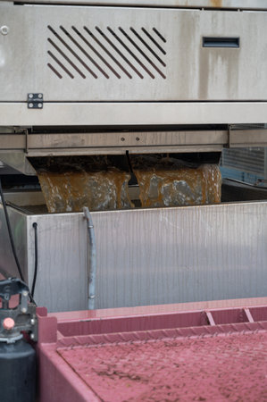 Works at distillery. Harvest time in Cognac white wine region, Charente, crushing and pressing of ugni blanc grape uses for Cognac strong spirits distillation, Grand Champagne, Franceの写真素材